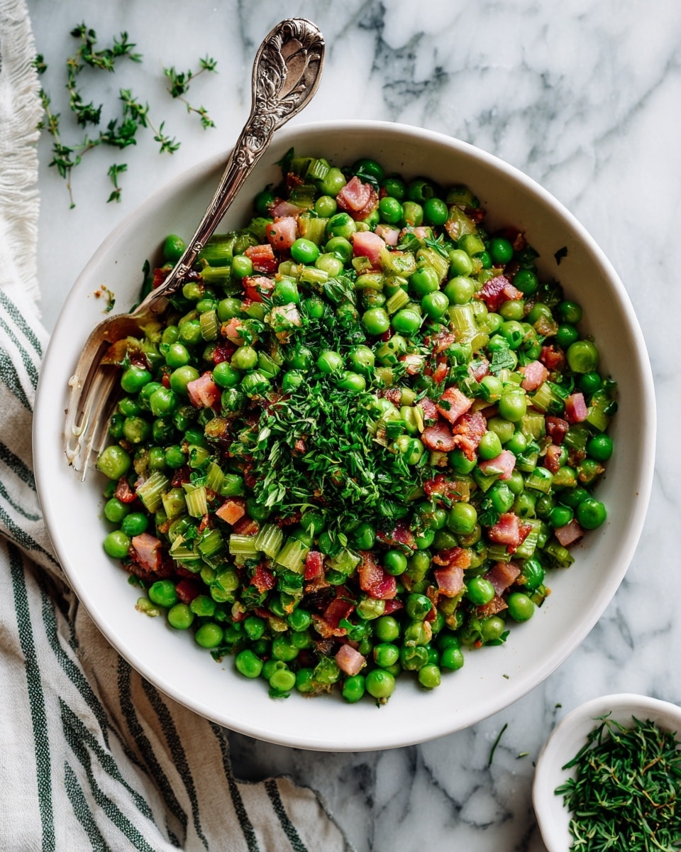 A white bowl filled with a mix of bright green peas, small chunks of pink bacon, and lighter green cooked celery pieces, all topped with chopped fresh green herbs. The peas and bacon pieces create a textured, colorful layer with the celery adding a bit of softness, and the herbs scattered on top add a fresh, leafy detail. A silver ornate spoon rests inside the bowl on the left side. Around the bowl, on a white marbled surface, are small bits of chopped herbs, a striped white and dark green cloth, and a small white dish with more chopped herbs. Photo taken with an iphone --ar 4:5 --v 7
